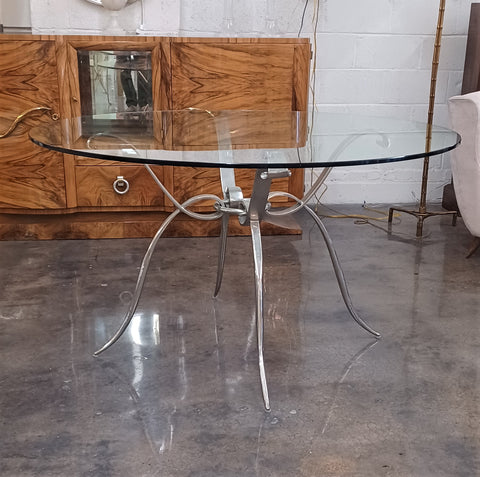 1940’s style nickel table base with a glass top in the style of Rene Prou